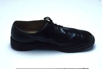 Black dress rubber soled left shoe