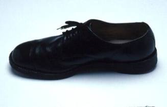 Black dress rubber-soled right shoe