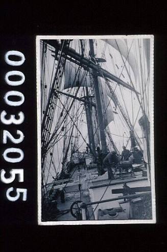 Three crew on deck house of the four masted barque POMMERN (Ex MNENE) 