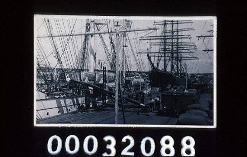 Racks of grain being loaded onto an unknown ship 