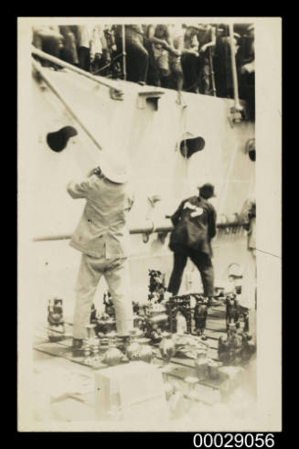 HMAS MELBOURNE at Port Said, traders selling their wares to the crew