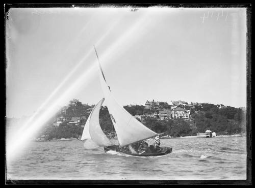 Possibly a 12/14' skiff on Sydney Harbour with 4 or 5 crew , inscribed 1414