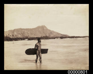 Surfer at a beach near Diamond Head, Hawaii