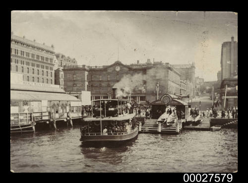 A ferry nearing a berth at Circular Quay facing Alfred Street