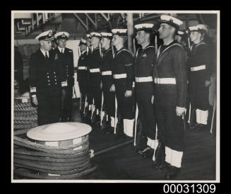 Admiral Farncomb inspecting crew from HMAS SYDNEY