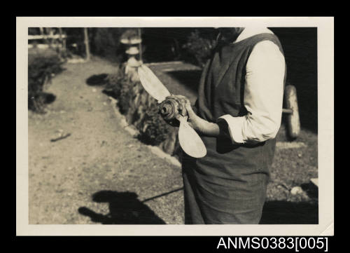 A man holding a propellor