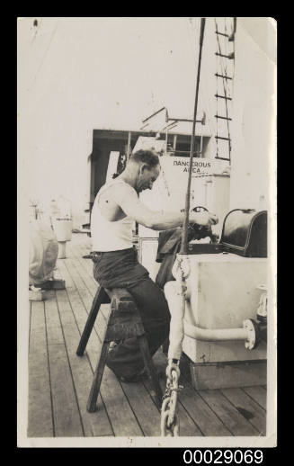 HMAS WARREGO, Philip Jay at the sewing machine - earning an honest bob or two
