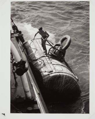 Tug deckhand and mooring buoy