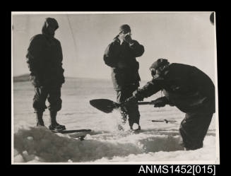 Men sourcing water from snow