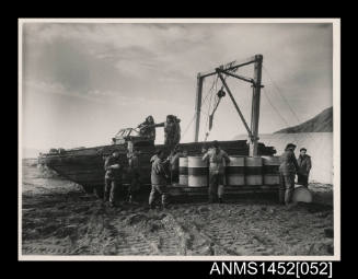Crew unloading oil at Buckles Bay