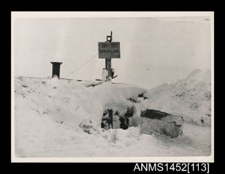 British Crown Land sign over buried nissen hut