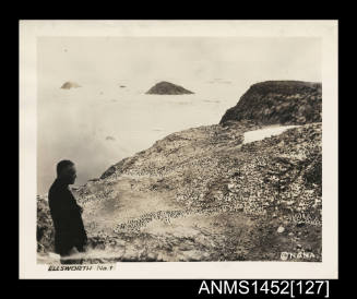 Lincoln Ellsworth surveying an island off the coast of Enderby Land, Antarctica