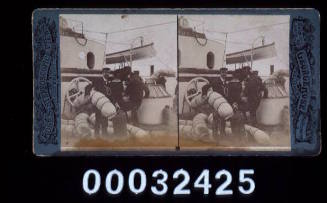 Stereoscope card featuring a naval contingent of sailors looking after their luggage