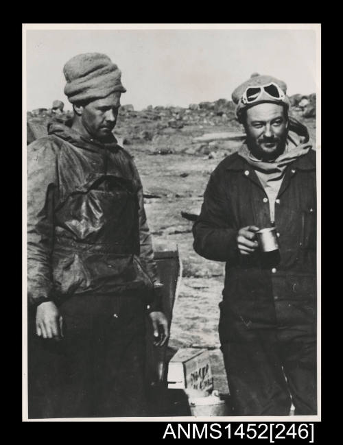 Robert Dovers and Bill Harvey during unloading operations at Mawson