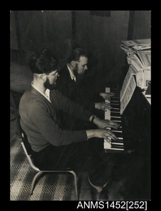 Physicists Leigh Speedy and Ken Hines playing the piano