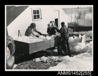 Mawson crew storing ice inside container