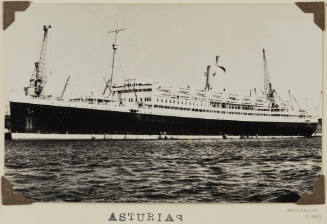 Photograph of  ASTURIAS depicting port side of passenger ship berthed at wharf on starboard side