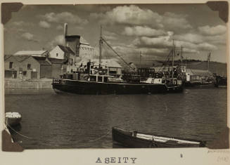 Photograph of  ASEITY depicting stern and starboard side of small cargo ship