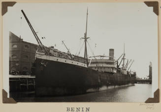 Photograph of  BENIN depicting bow and port side of cargo ship  berthed at wharf on starboard side