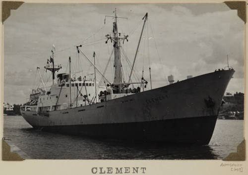 Photograph CLEMENT depicting bow and starboard  side of  cargo ship under way in harbour with land on port side