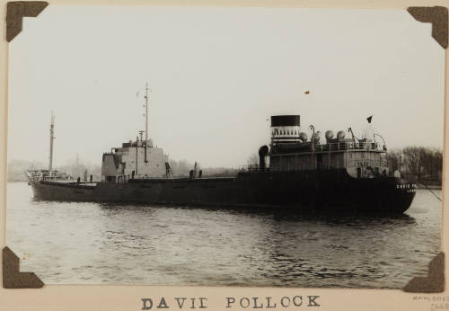 Photograph  DAVID POLLOCK depicting stern and port side of bulk cargo ship off shore on starboard side