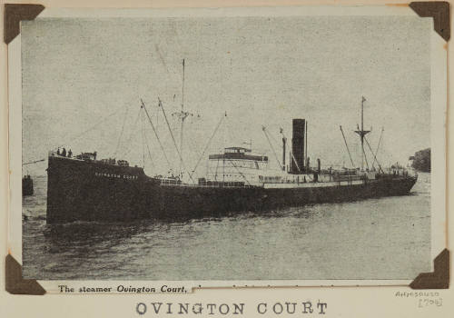 Post card photograph  OVINGTON COURT depicting bow and port side of  cargo ship in harbour with ?tug at bow centre left