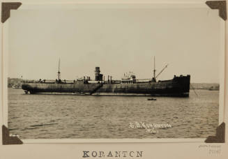 Photograph  KORANTON depicting  starboard side of  cargo ship  at anchor in harour
