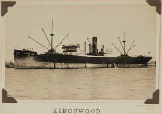 Photograph  KINGSWOOD depicting  port side of  cargo ship  in harbour