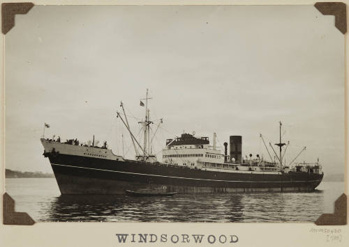 Photograph  WINDSORWOOD depicting  port side of  cargo ship  under way off distant shore on starboard side