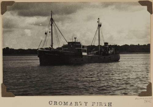 Photograph of  CROMARTY FIRTHI depicting  bow and port side of cargo  ship under way at sea off distant shore on starboard side