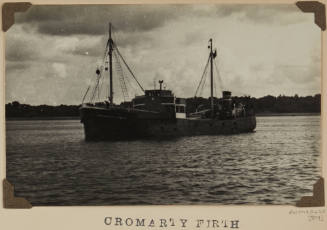 Photograph of  CROMARTY FIRTHI depicting  bow and port side of cargo  ship under way at sea off distant shore on starboard side