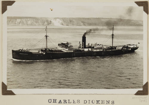 Photograph of  CHARLES DICKENS depicting the  port side view of cargo ship under way at sea