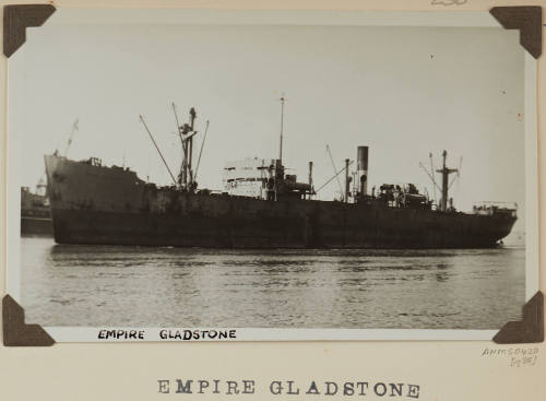 Photograph of  EMPIRE GLADSTONE depicting port side view of cargo ship  under way in harbour