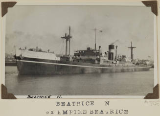 Photograph of  BEATRICE N depicting port side view of cargo ship under way in harbour off land/ buildings on starboard side