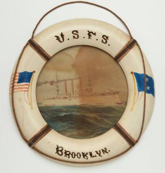 Miniature lifebuoy with and image of USS BROOKLYN mounted inside