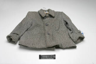 Grey lined woollen jacket with three plastic grey buttons on the front and two pockets