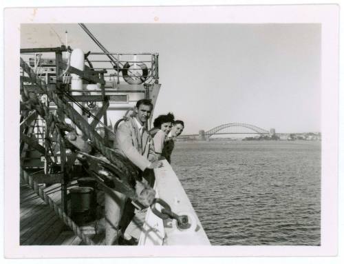 Three passengers on the deck of migrant ship MV NAPOLI in Sydney Harbour