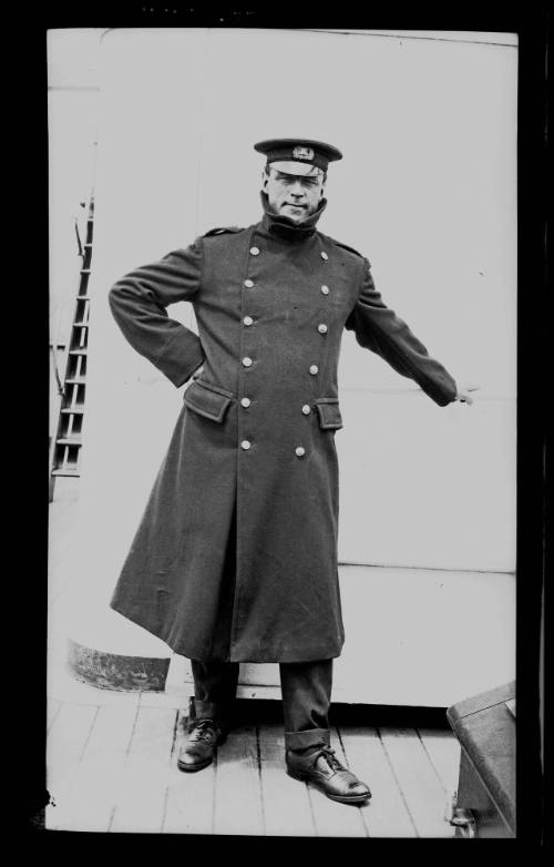 Ships and steamer crews, man standing on deck