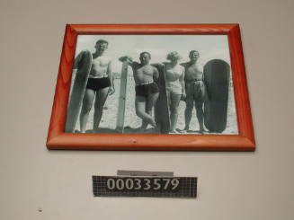 Jack and Ken Gaetjens, Bettine Mitchell, and Robert MacDonald with their surfboards
