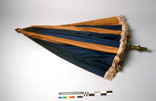 Beach umbrella, blue and yellow panels, white fringe