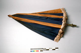 Beach umbrella, blue and yellow panels, white fringe