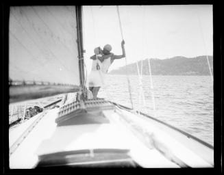 A young couple embracing on the deck of a yacht