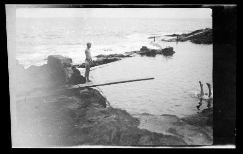 Diving off a board into an ocean bath