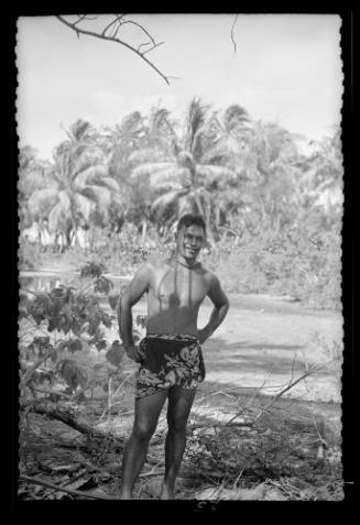 A young man from Bora Bora wearing a patterned pareu