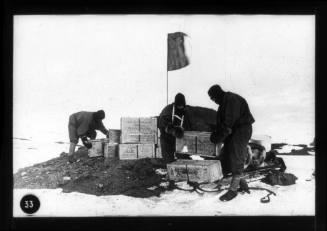 Three men laying a depot of Huntley and Palmer's biscuits