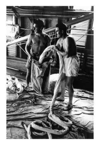 Crew of 18-foot skiff JANTZEN GIRL Robby Shaw and Noel Bungate stropping the spinnaker