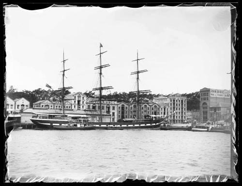 Three-masted sailing ship at East Circular Quay wharf