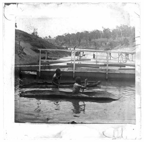 Men in bark canoes