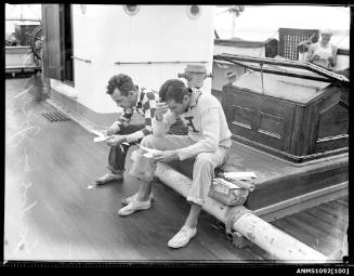 Crew of the ship JOSEPH CONRAD read their mail after arriving in Sydney
