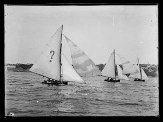 Possibly 14'foot skiffs  on Sydney Harbour, closest vessel has questionmark sail insignia. Inscribed 5468 below headsails of lead skiff.